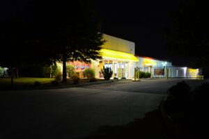AA Self Storage white flatbed truck and trailer at the Lynchburg VA facility for portable storage and vehicle transport