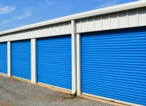 exterior view of blue roll-up doors on climate controlled storage units at AA Self Storage building in Lynchburg VA