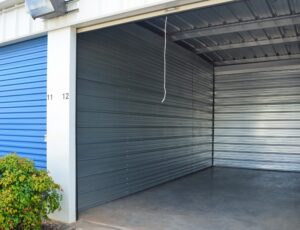 open climate controlled storage unit with gray roll-up door at AA Self Storage in Lynchburg VA showing interior space
