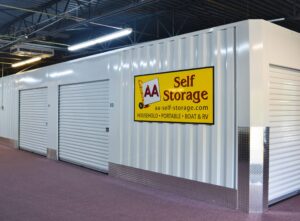 AA Self Storage branding sign on interior wall highlighting household, portable, boat and RV storage at the Lynchburg VA facility