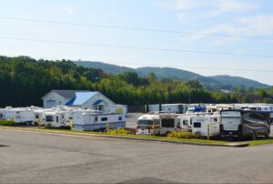 boat and RV storage parking lot at AA Self Storage in Lynchburg VA filled with RVs and trailers with scenic hills in the background