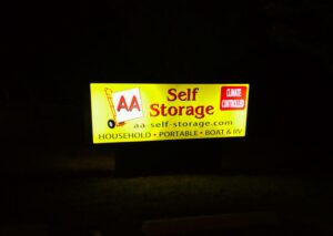 illuminated AA Self Storage sign at night highlighting climate controlled storage at the Lynchburg VA facility