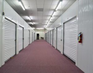wide carpeted hallway inside the secure climate controlled storage building in Oxford NC