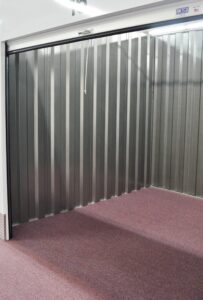 spacious empty interior of a climate controlled storage unit featuring secure metal walls in Oxford NC