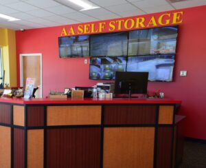 reception desk and 24 hour video surveillance monitoring system inside the Oxford NC self storage office