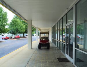 covered exterior walkway and glass storefront of the AA Self Storage leasing office in Raleigh NC