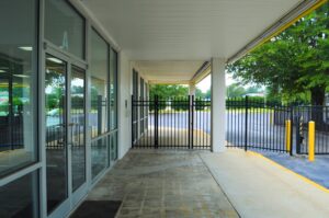 secure black metal perimeter fencing and gated entrance at the Raleigh NC self storage facility